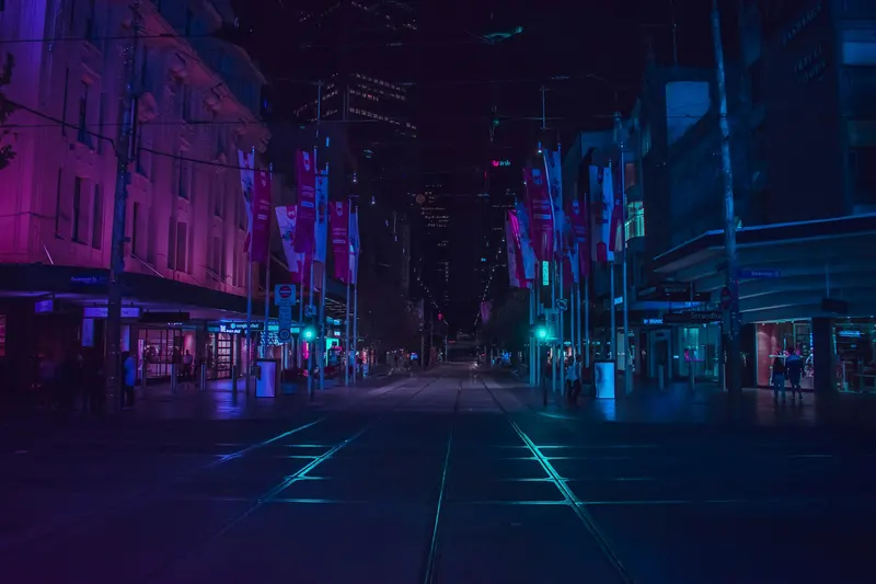 An empty city street illuminated after dark